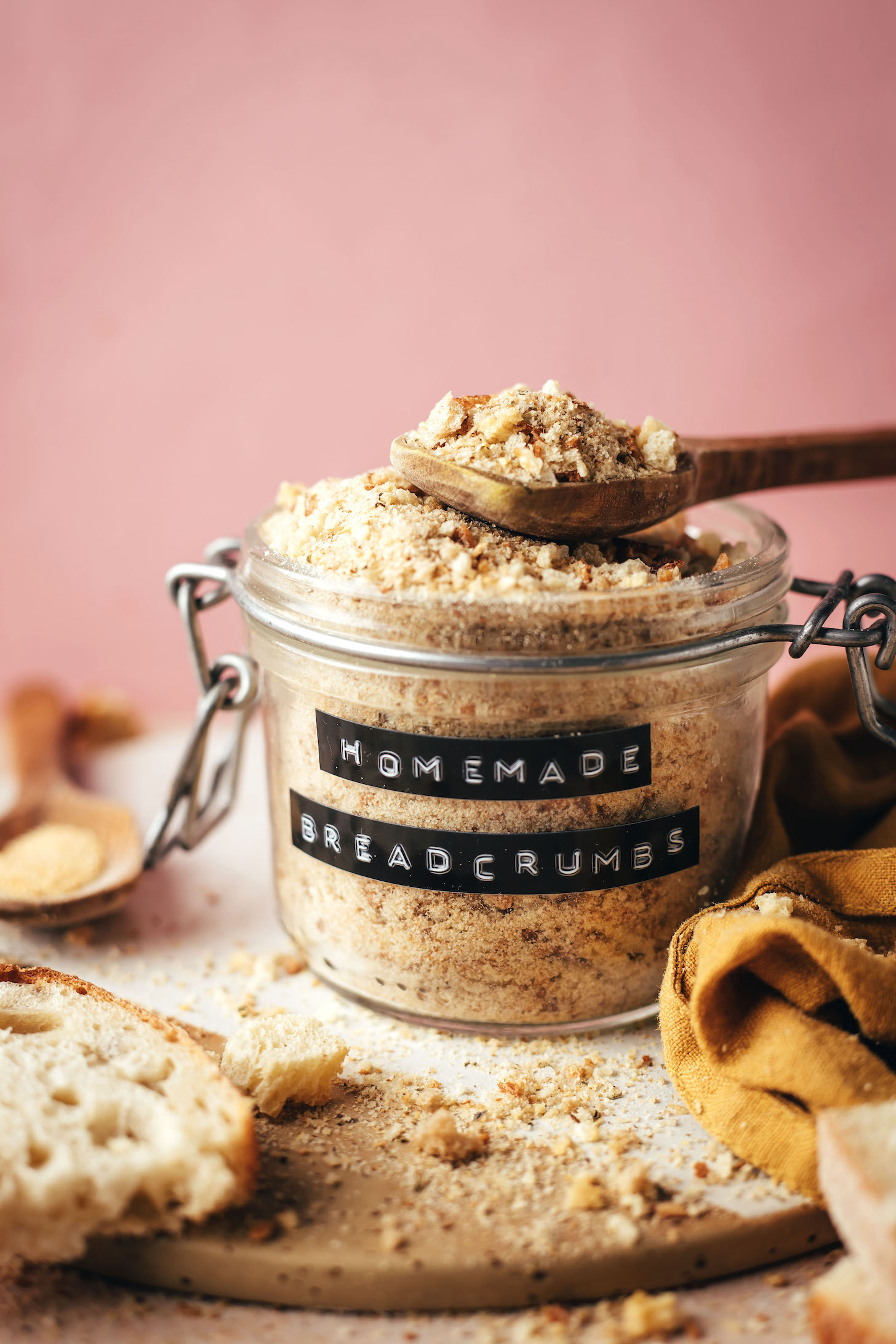 Jar and spoon of homemade breadcrumbs for our guide to making breadcrumbs