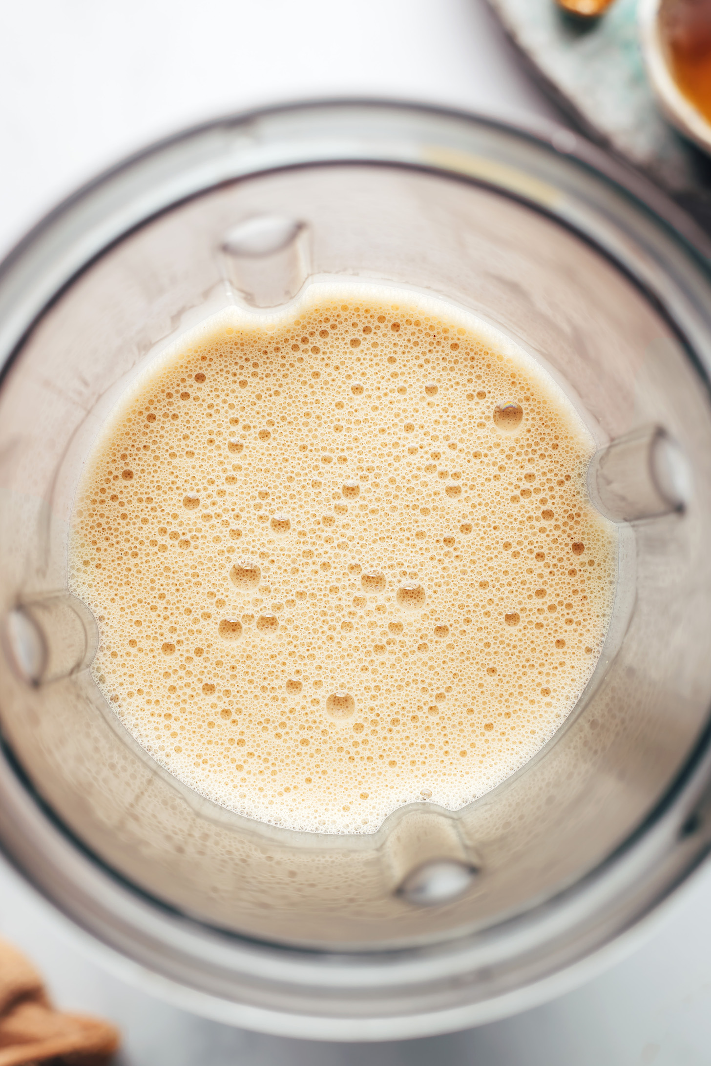 Frothy latte in a blender