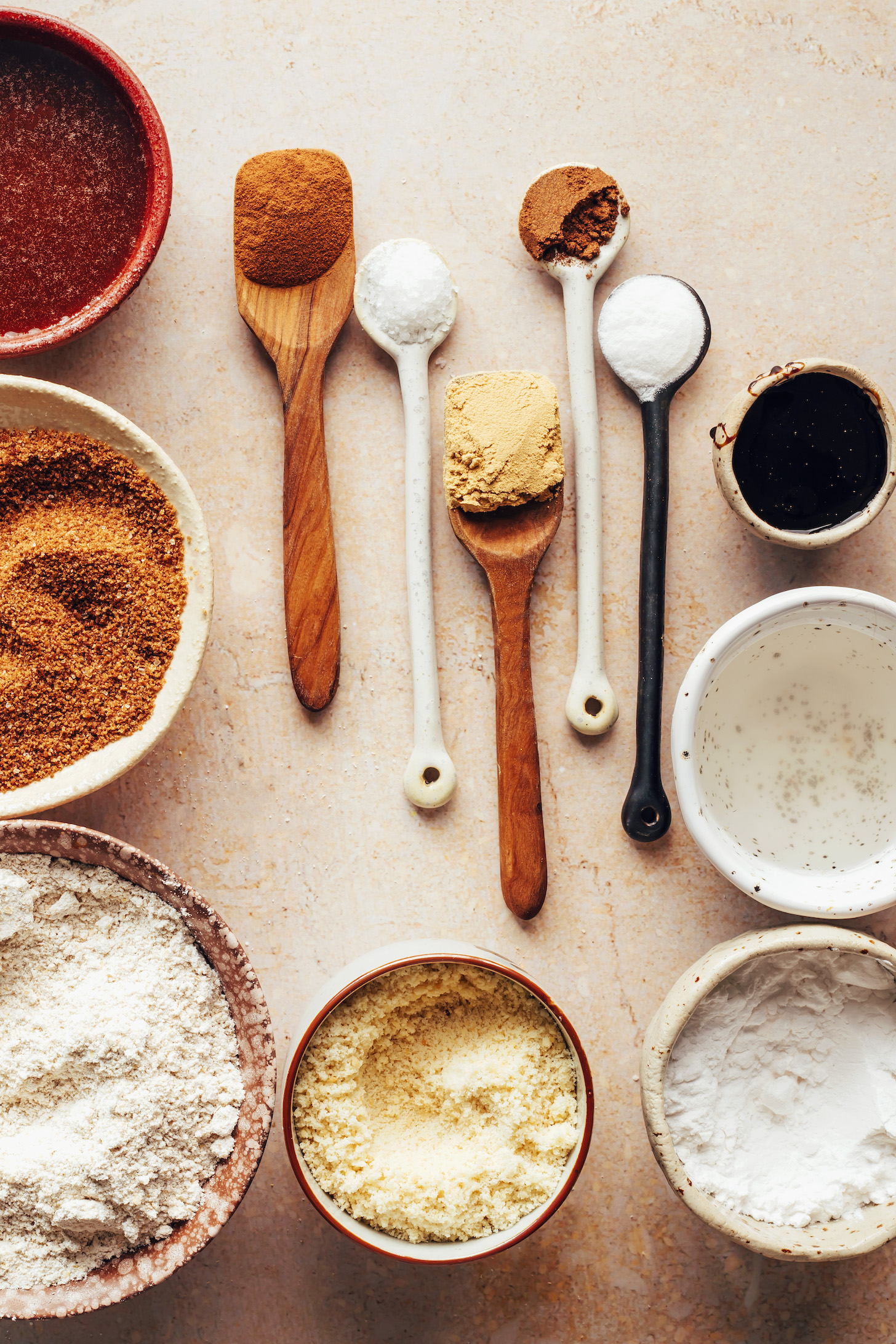Salt, spices, baking soda, molasses, coconut oil, arrowroot flour, almond flour, oat flour, coconut sugar, and maple syrup