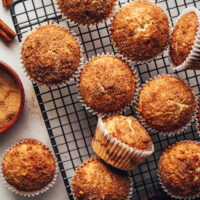 Vegan gluten-free cinnamon muffins on a cooling rack