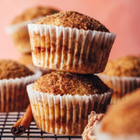 Close up shot of two stacked cinnamon swirl muffins