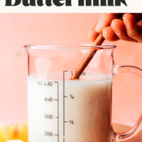 Stirring vegan buttermilk in a measuring glass