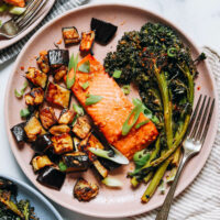Overhead shot of a plate of miso-glazed salmon, eggplant, and broccolini