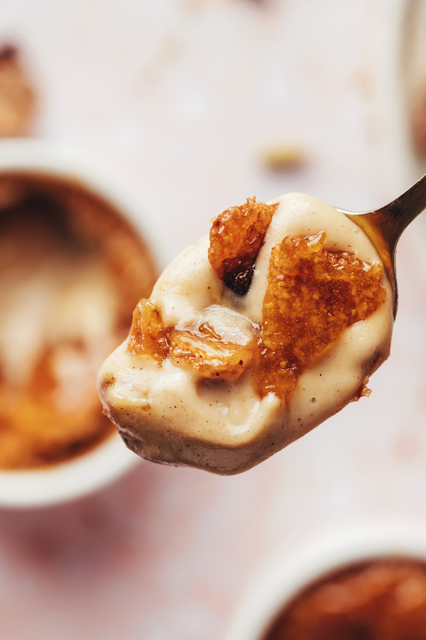 Spoonful of creamy chai-spiced creme brulee with a crackly top layer