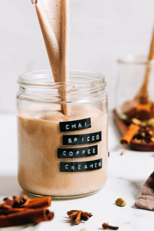 Pouring dairy-free chai-spiced coffee creamer into a jar
