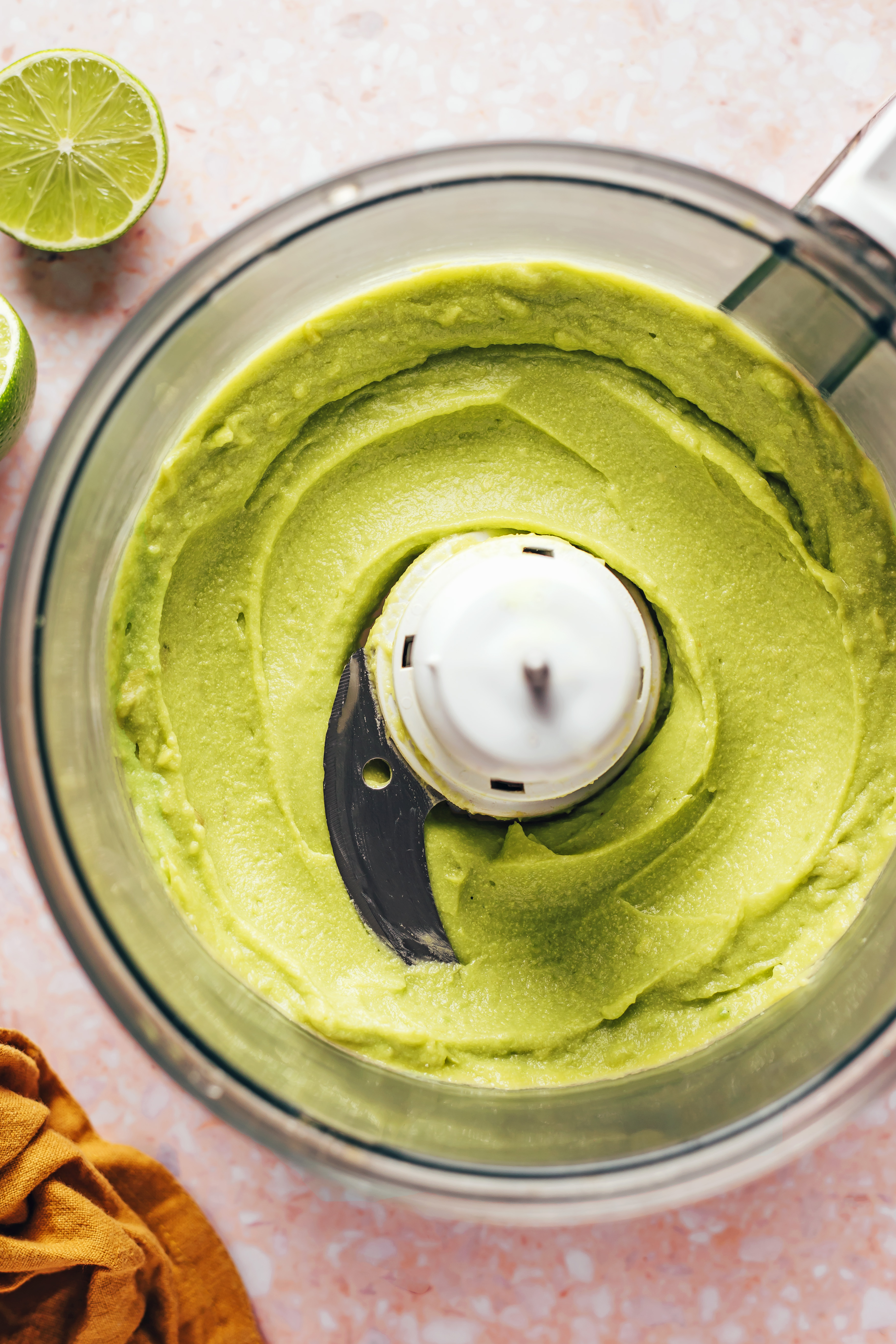 Creamy vegan avocado dip in a food processor