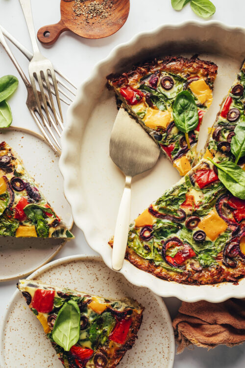 Slices of dairy-free quiche in a pie pan and on plates
