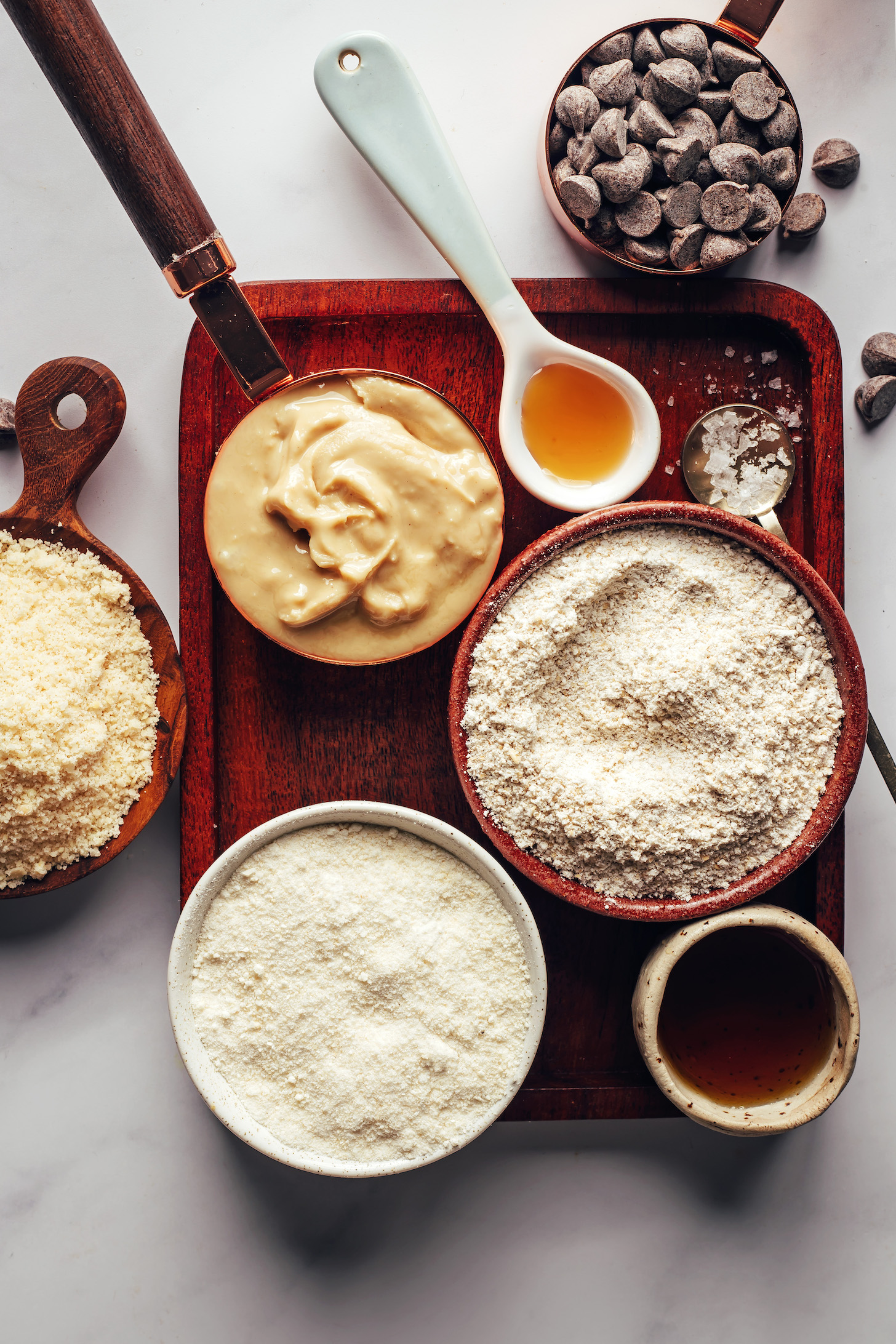 Cashew butter, vanilla, salt, chocolate chips, oat flour, maple syrup, coconut flour, and almond flour