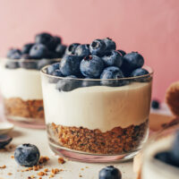 No-bake vegan cheesecake cups topped with fresh blueberries