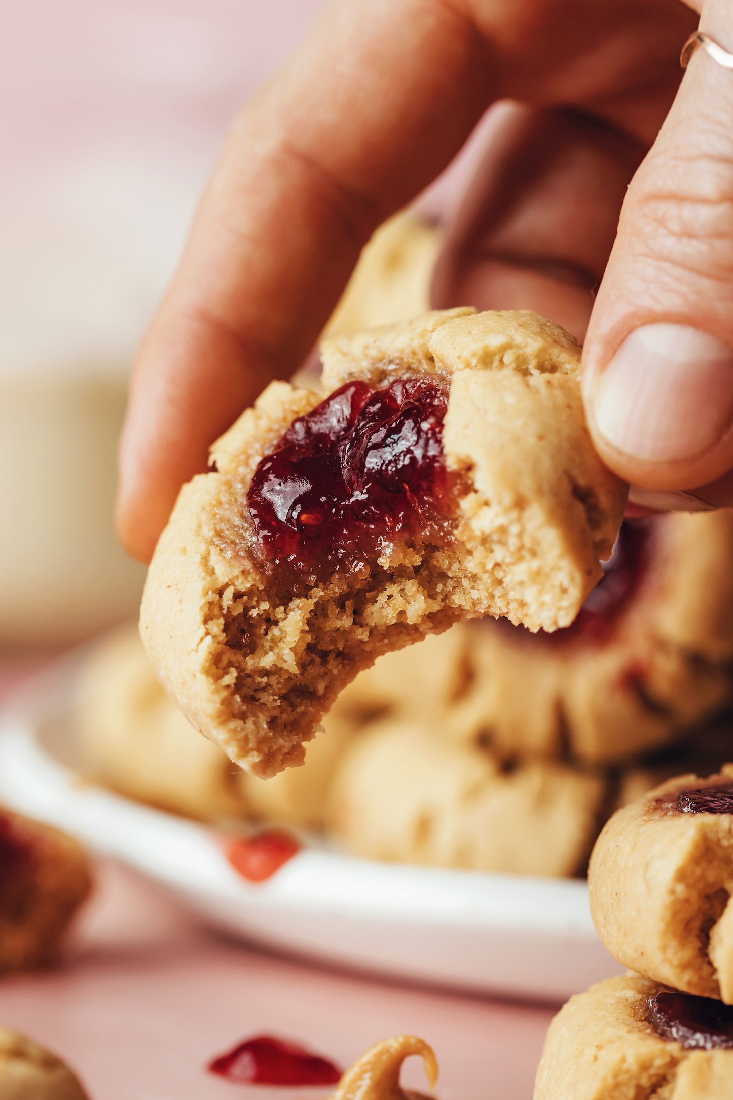 Hold a partially eaten thumbprint cookie to reveal the soft, jam-filled center