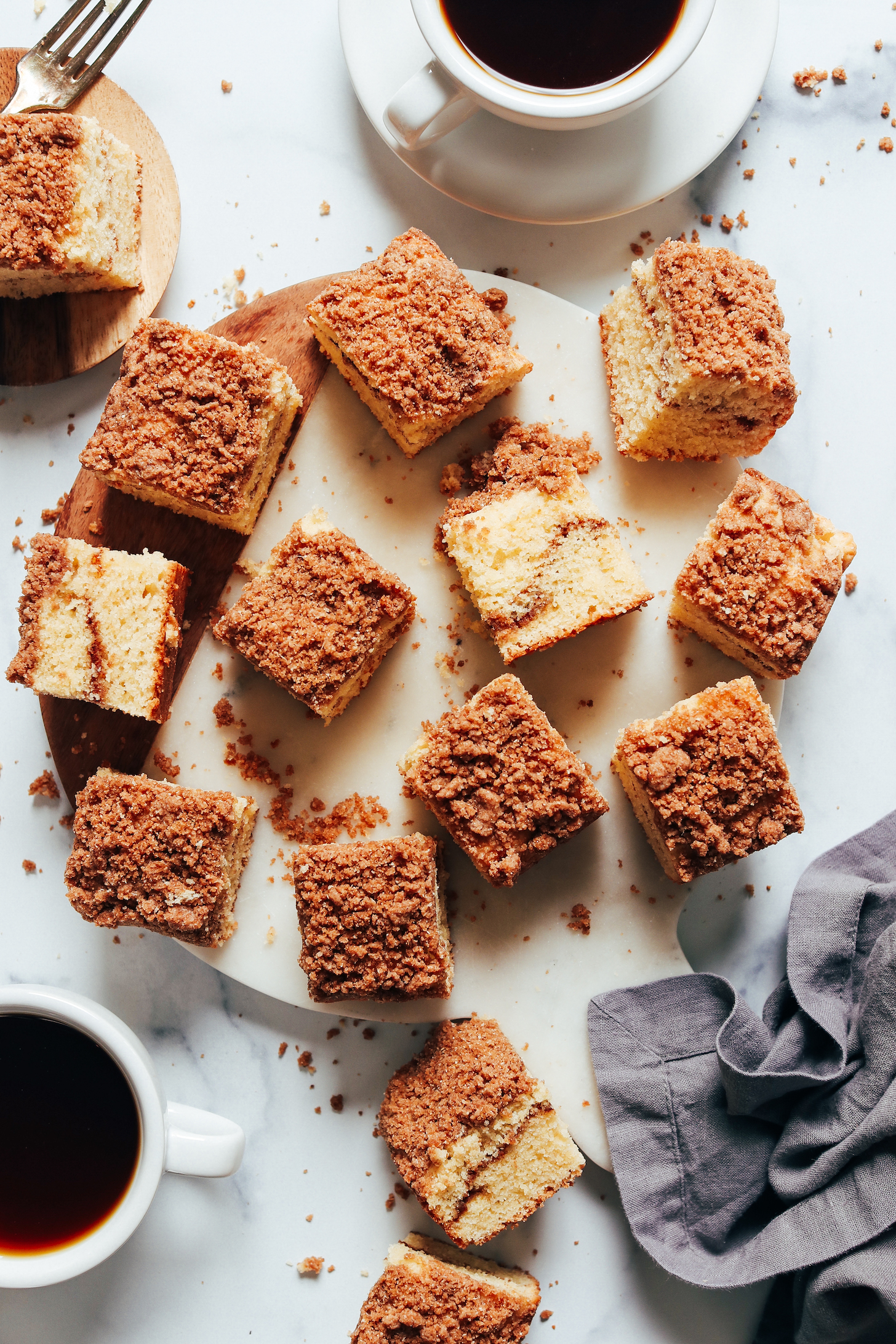 Mugs of coffee next to slices of gluten-free coffee cake