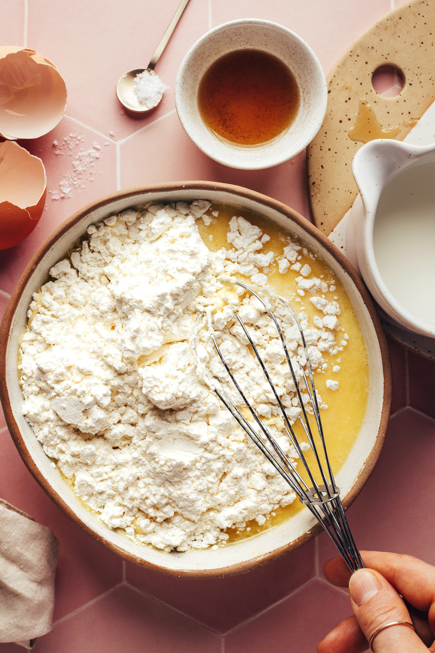 Whisking gluten-free flour into the wet ingredients