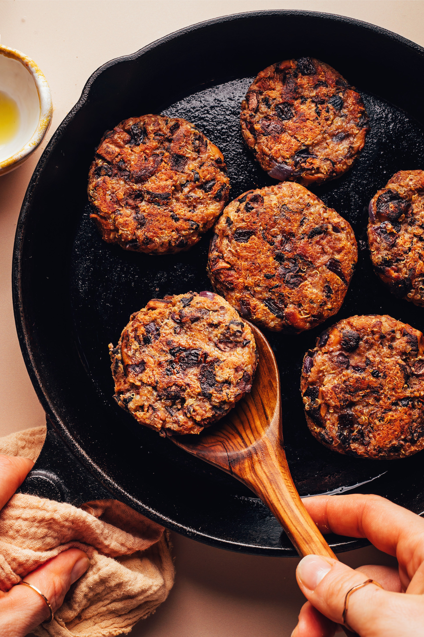 Lightly browned mushroom black bean fritters in a cast iron skillet
