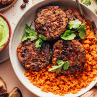 Vegan black bean fritters in a bowl with sweet potato rice
