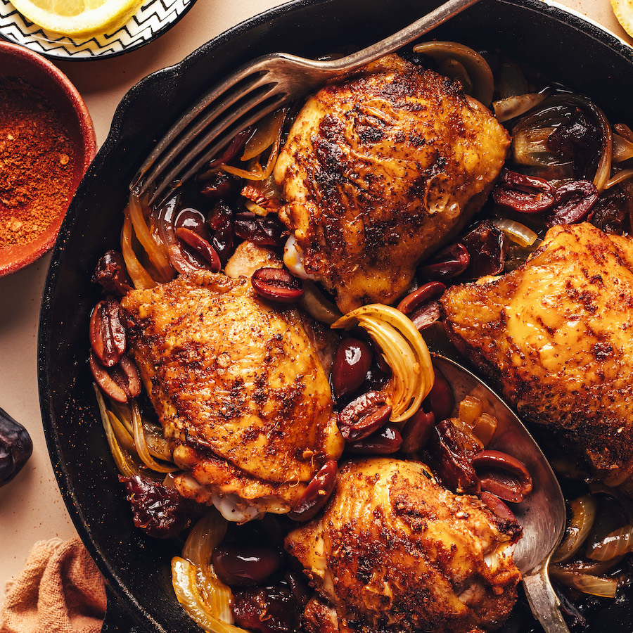 Skillet of our Mediterranean Baked Chicken Thighs with dates and olives