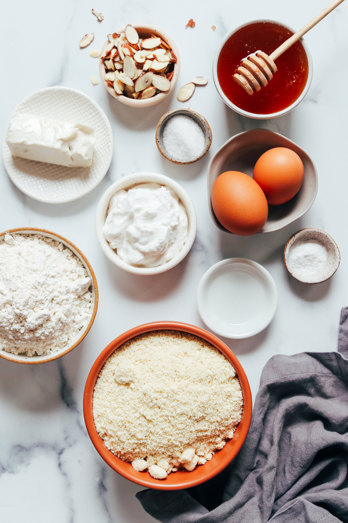 Almond flour, gluten-free flour blend, dairy-free butter, almonds, dairy-free yogurt, salt, eggs, honey, almond extract