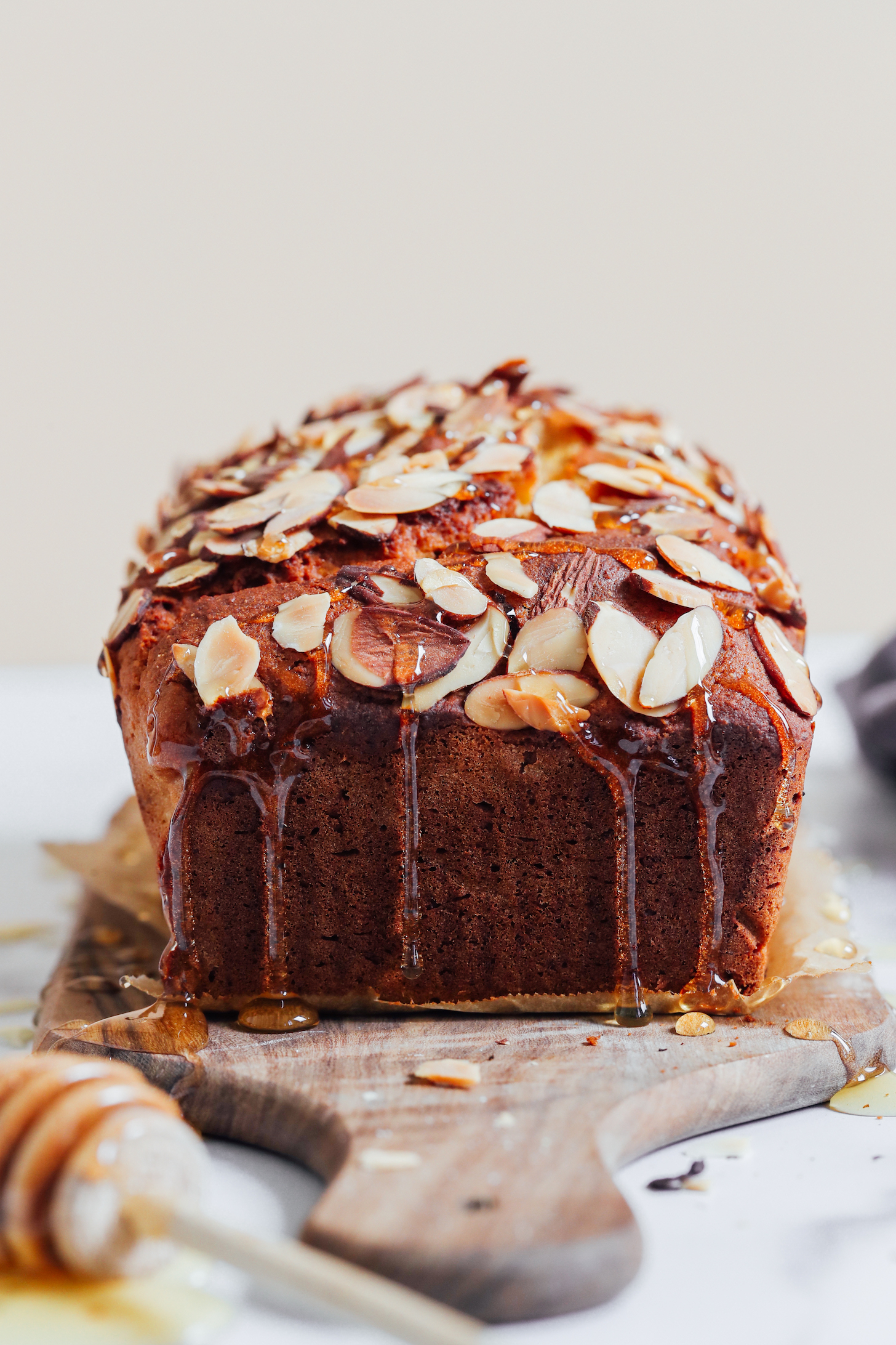 Honey dripping down the sides of a loaf cake