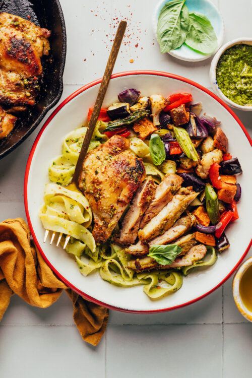Bowl with pesto pasta, pesto chicken, and roasted vegetables
