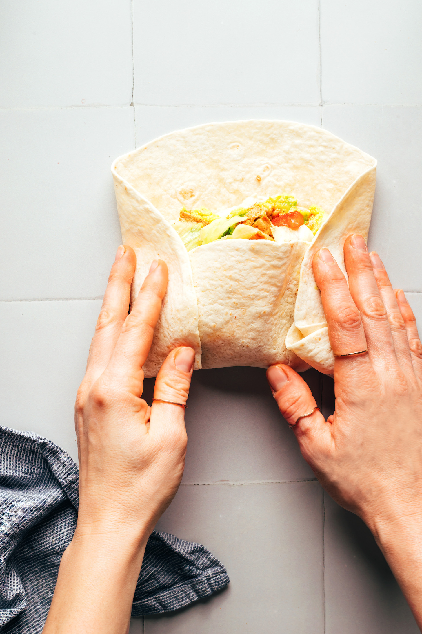 Three sides folded on a burrito to show how to seal it
