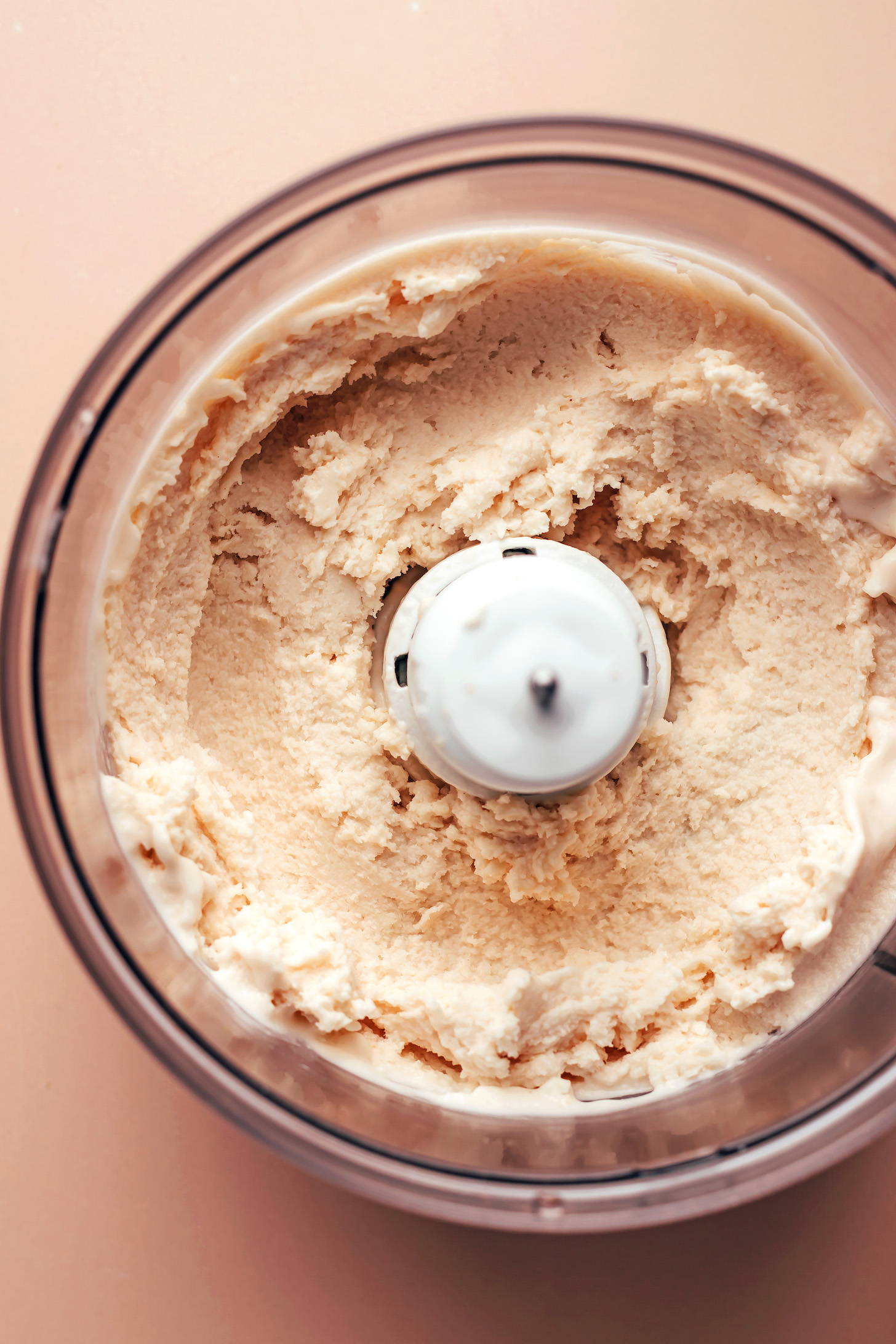 Vegan vanilla soft serve ice cream in a food processor
