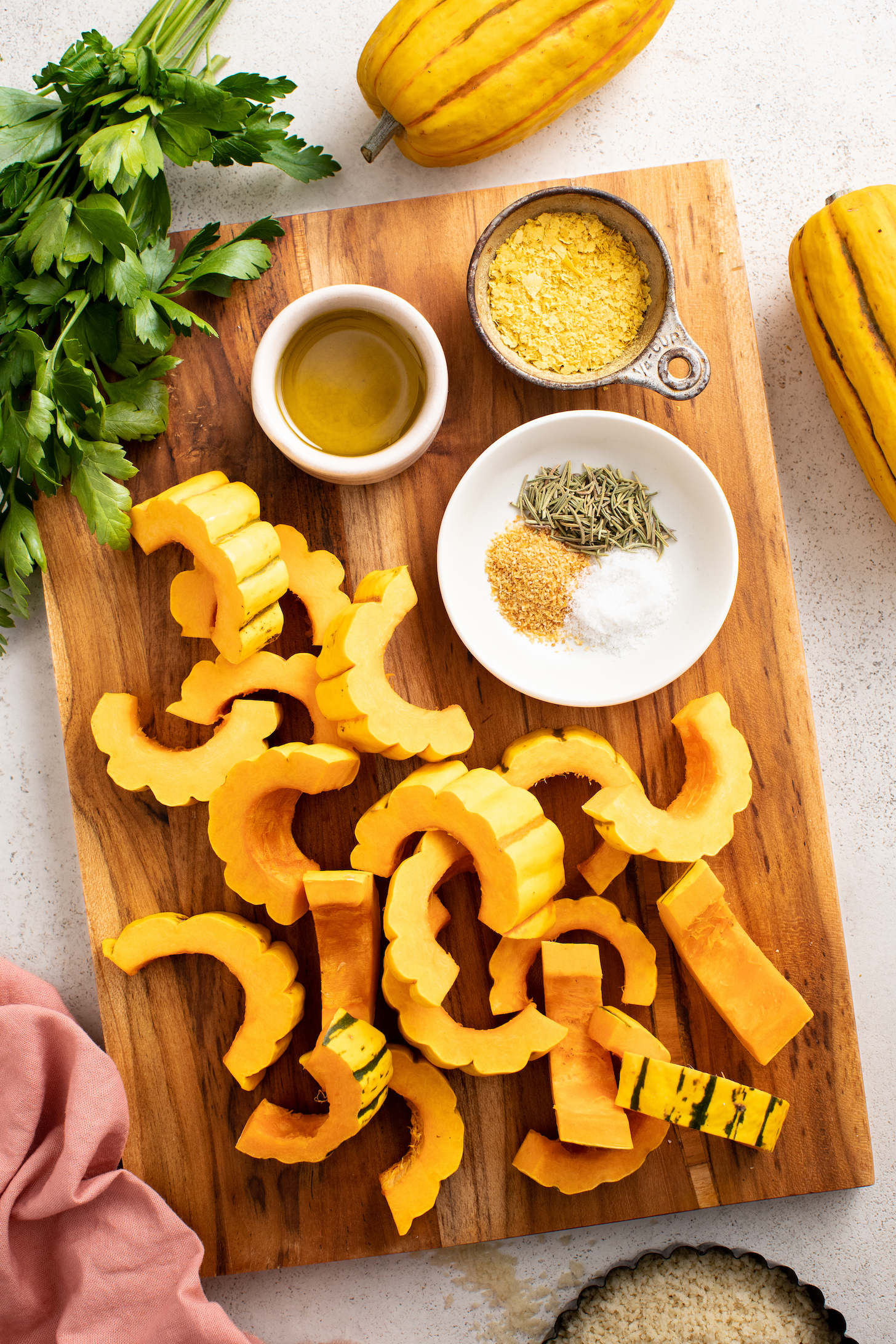 Fresh parsley, olive oil, nutritional yeast, delicata squash, salt, dried rosemary, and garlic powder