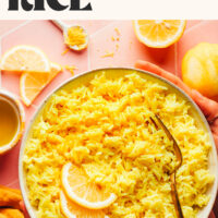 Bowl of lemon rice with text above it saying Easy Lemon Rice Greek-Inspired