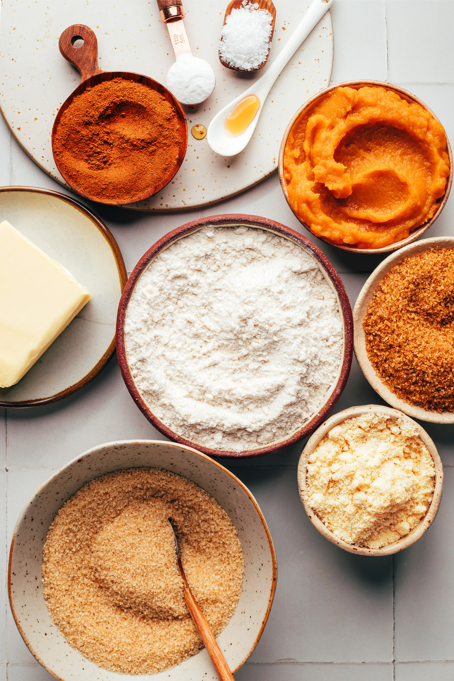 Pumpkin pie spice, baking powder, salt, vanilla, pumpkin purée, brown sugar, almond flour, cane sugar, gluten-free flour, and vegan butter