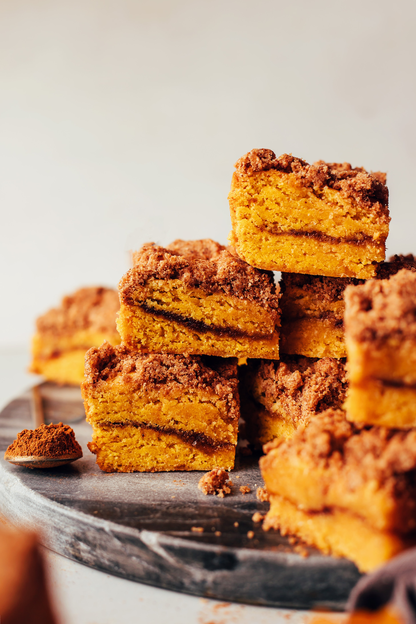Stack of sliced of pumpkin coffee cake pieces