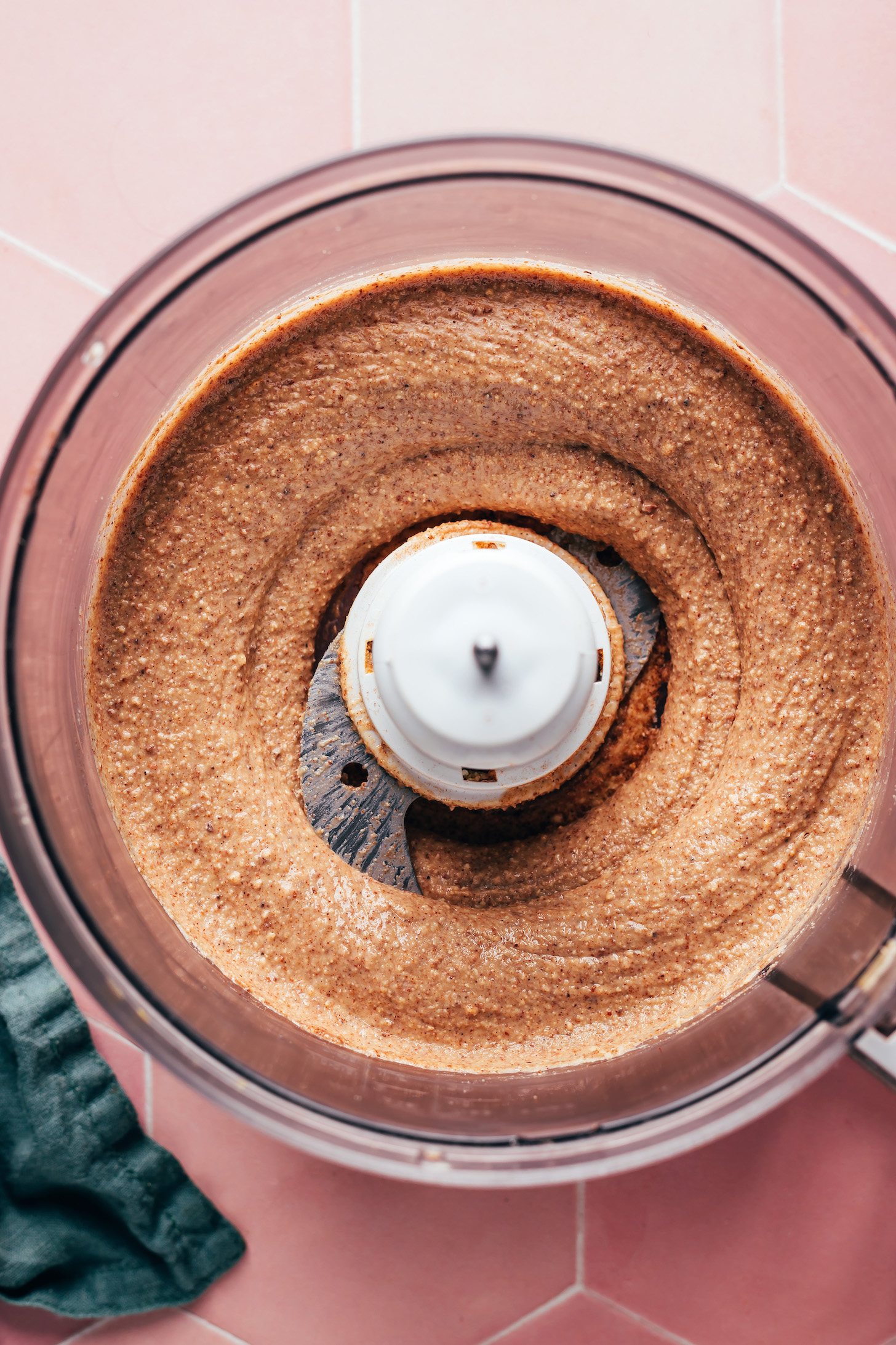 Freshly blended chai nut butter in a food processor
