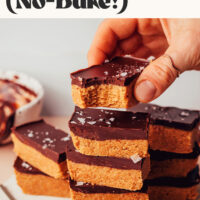 Stacks of no-bake peanut butter cup bars on a ceramic platter