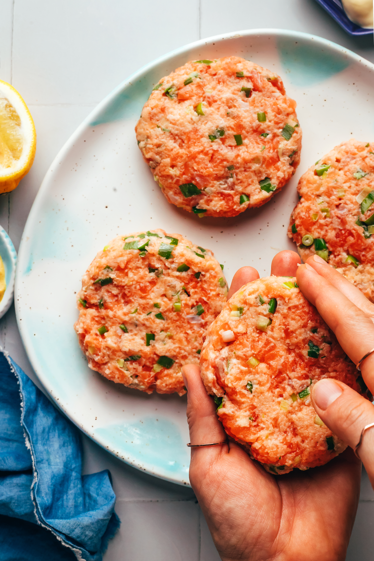 Forming a salmon patty into a burger shape