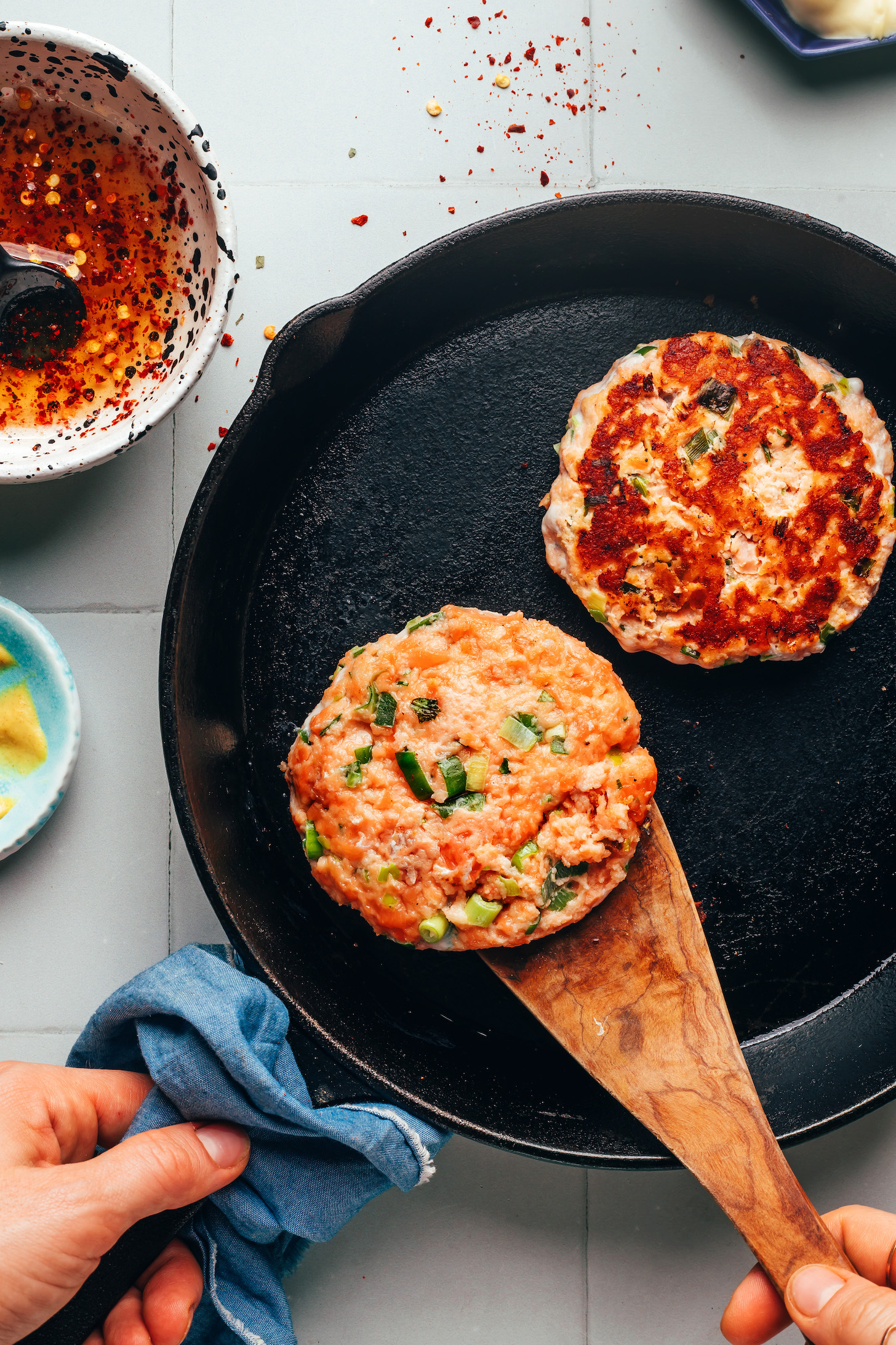 Cooking salmon burgers in a cast iron skillet