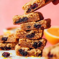 Close up photo of a stack of cranberry orange cookie bars