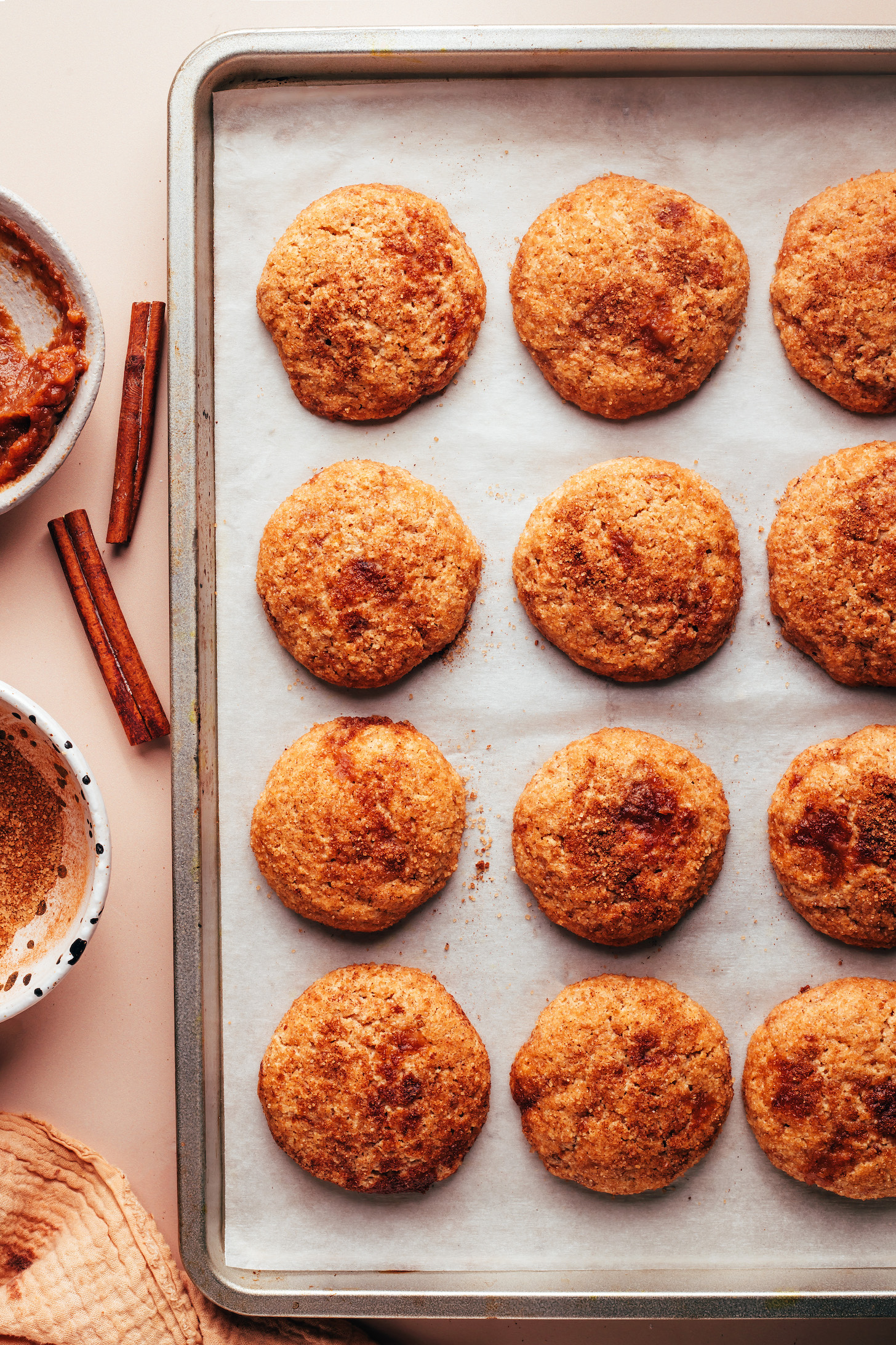 Freshly baked apple butter snickerdoodles on a baking sheet