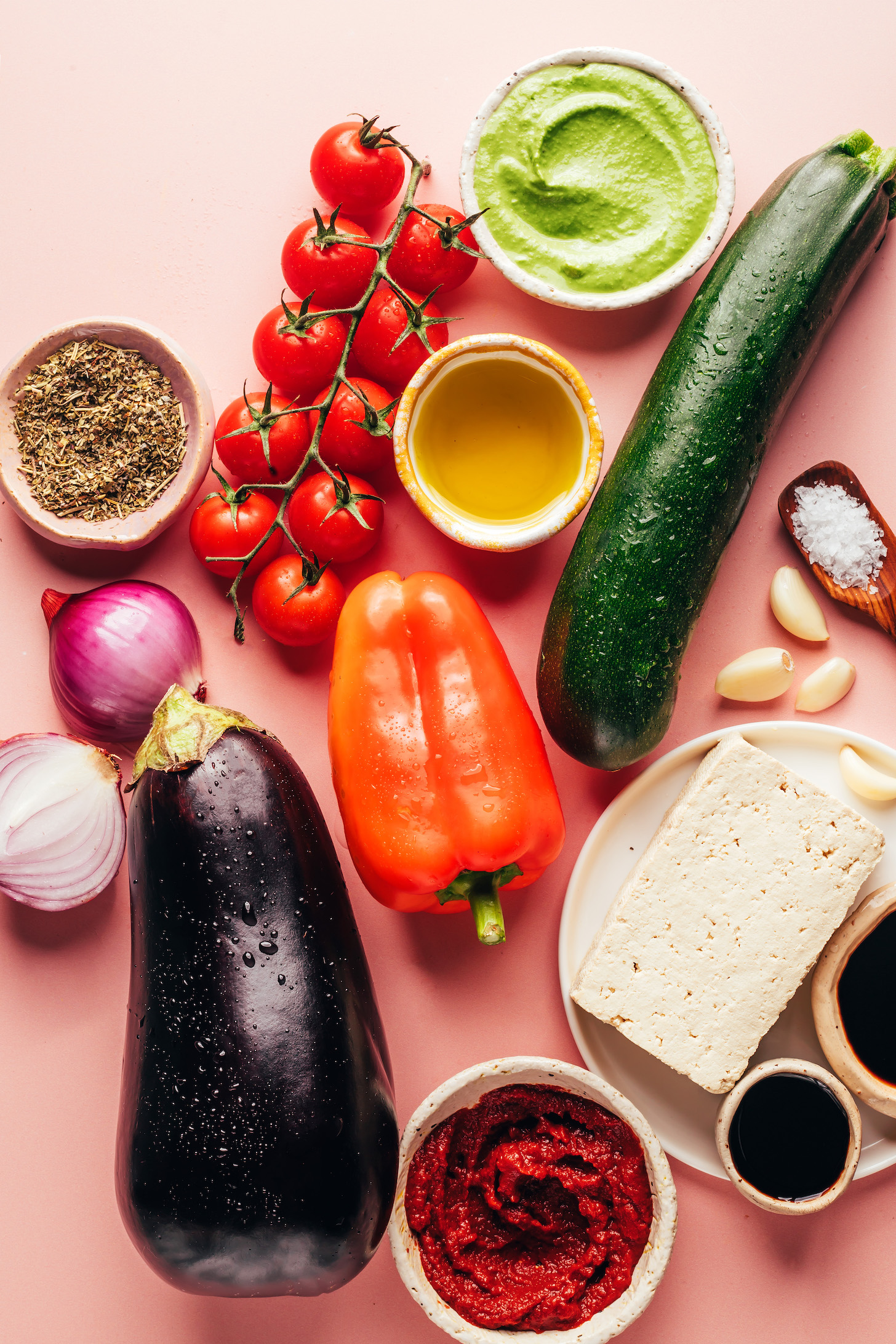 Cherry tomatoes, creamy pesto sauce, olive oil, zucchini, garlic, salt, tofu, tomato paste, tamari, balsamic vinegar, eggplant, bell pepper, onion, and dried Italian herbs