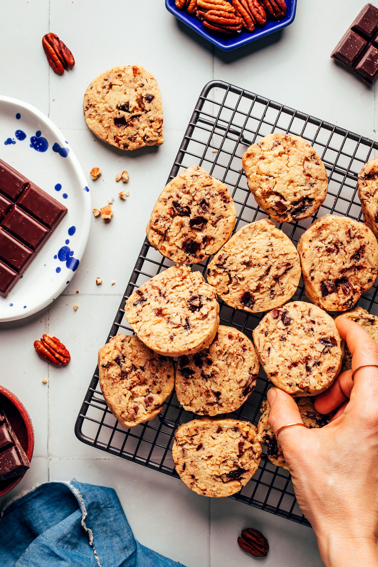 Cooling rack with vegan gluten-free dark chocolate pecan shortbread cookies