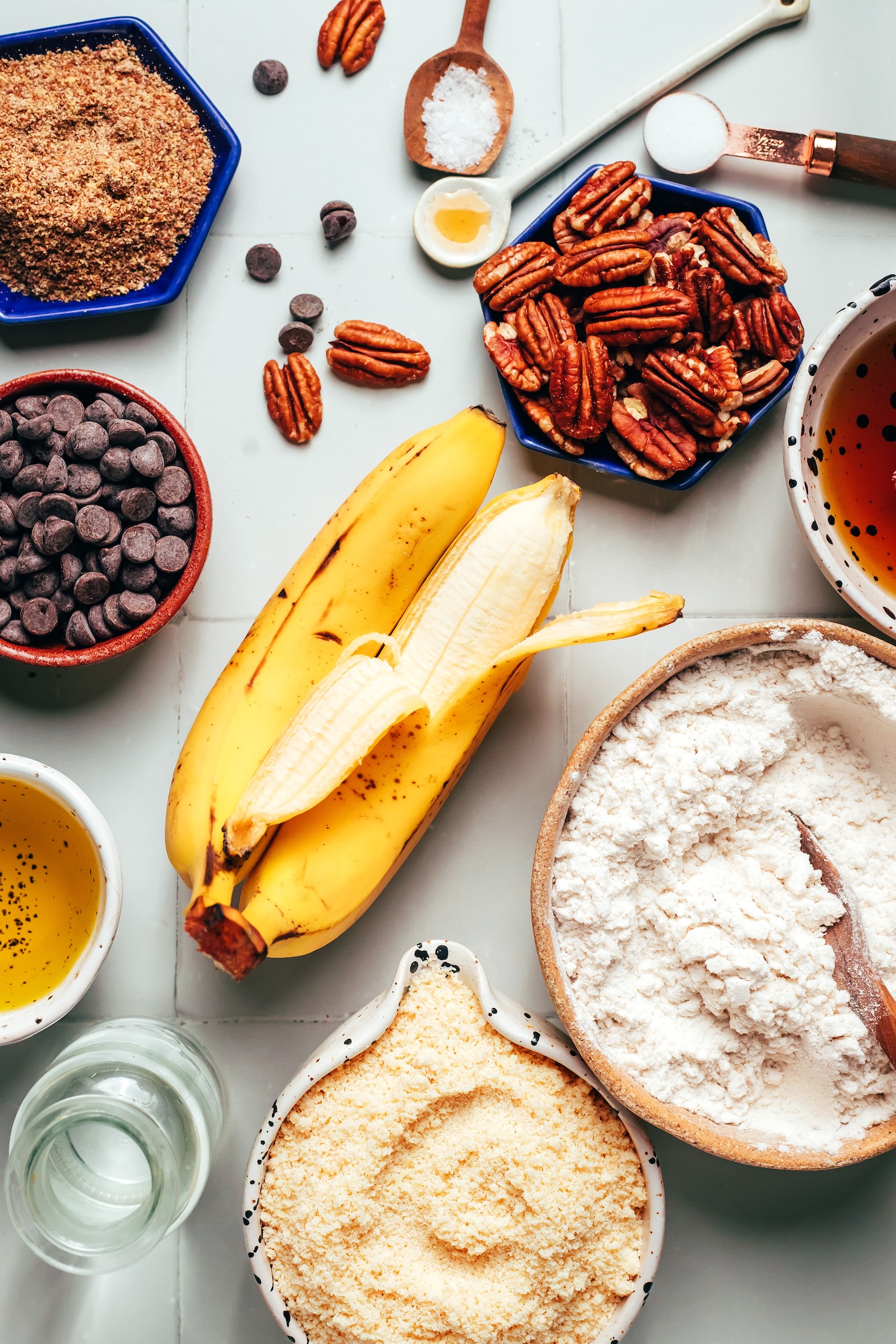 Flaxseed meal, chocolate chips, avocado oil, water, almond flour, gluten-free flour blend, bananas, pecans, maple syrup, salt, vanilla, and baking soda