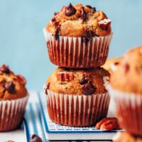 Stack of two vegan gluten-free banana chocolate chip nut muffins