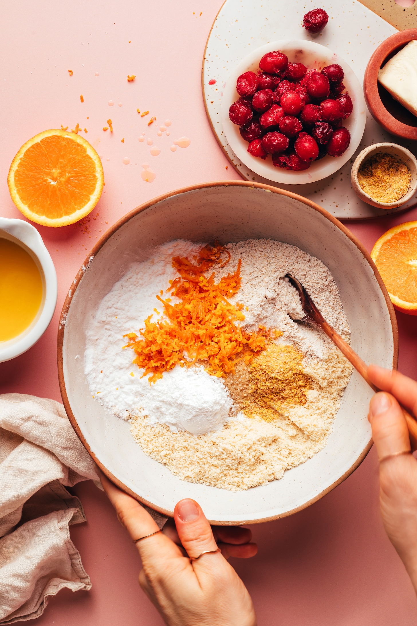 Gluten-free flours, flax meal, and orange zest in a mixing bowl