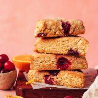 Stack of vegan gluten-free cranberry orange scones