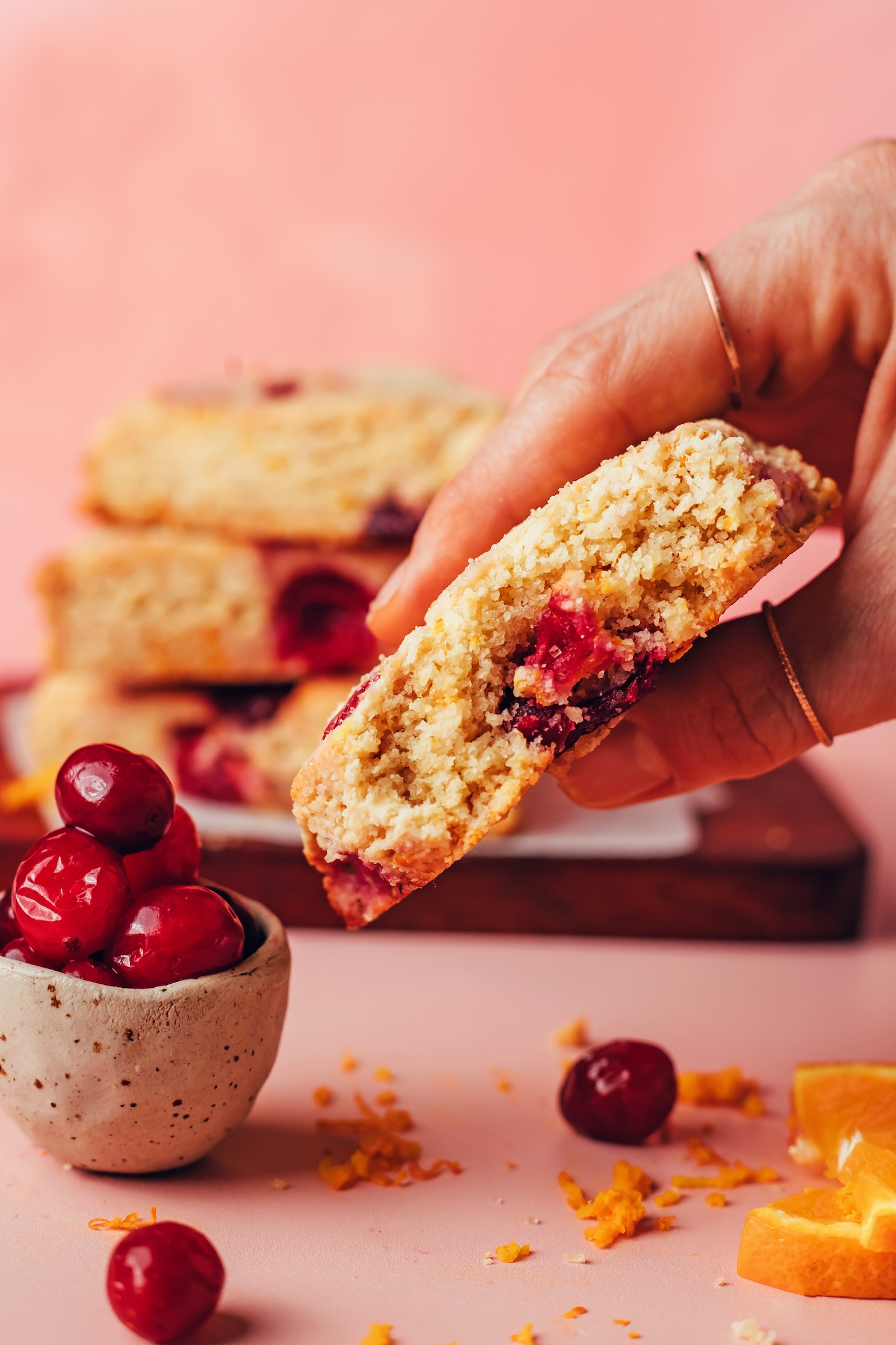 Close up photo of a cranberry orange scone showing the perfect crumb texture