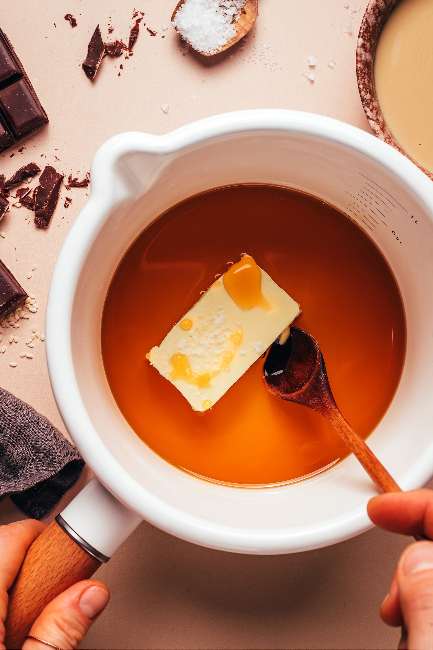 Vegan butter, sea salt, vanilla, and maple syrup in a saucepan