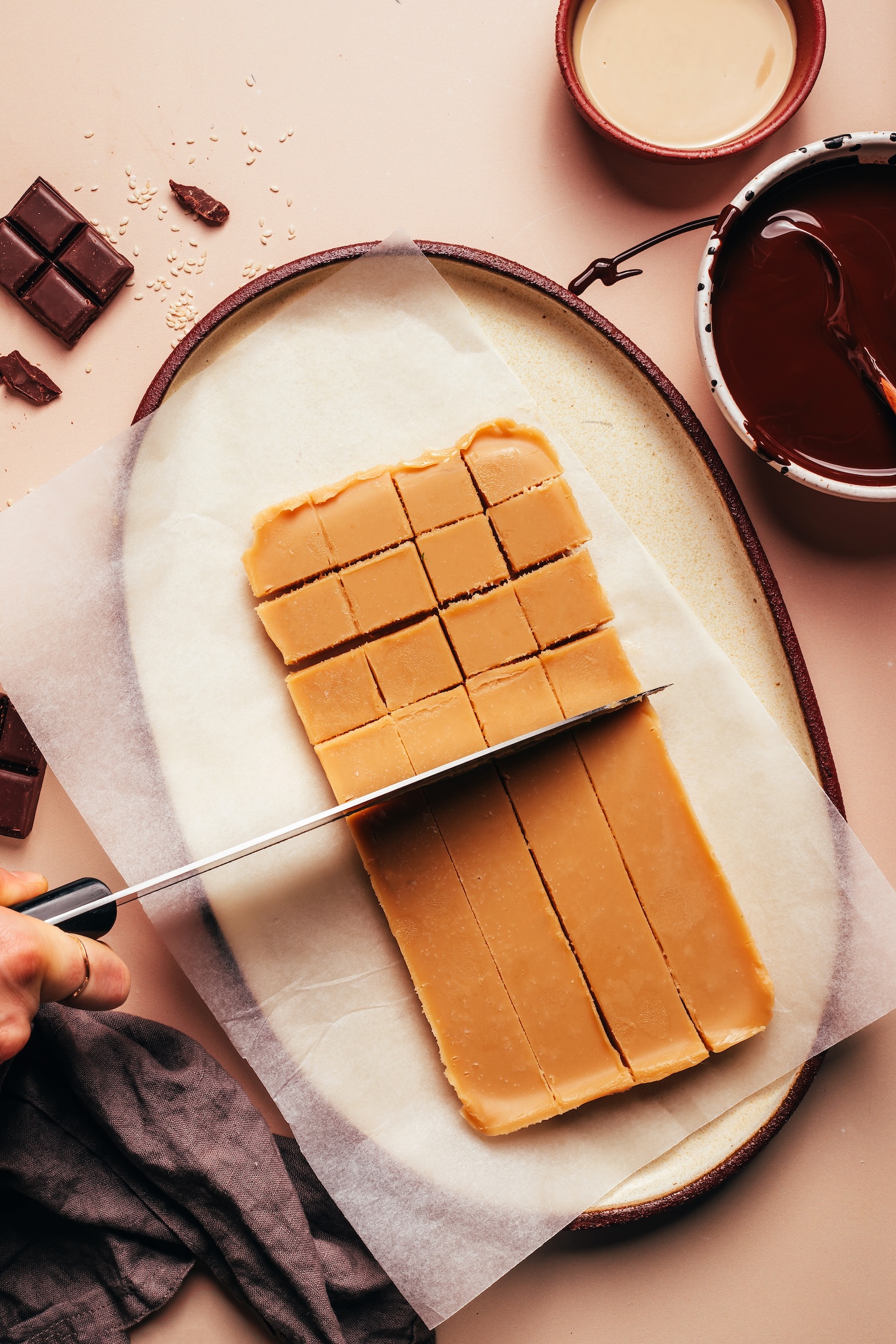 Slicing a sea salt tahini caramel mixture