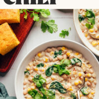 Bowl of creamy vegan white bean chili with text above it saying 30-minute meal